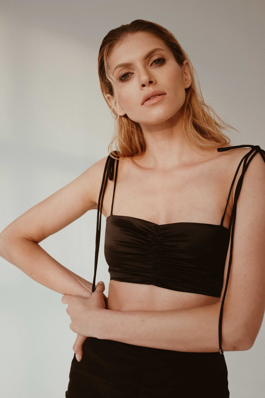 Ruched silk satin top with adjusted tie-straps in black and nickel